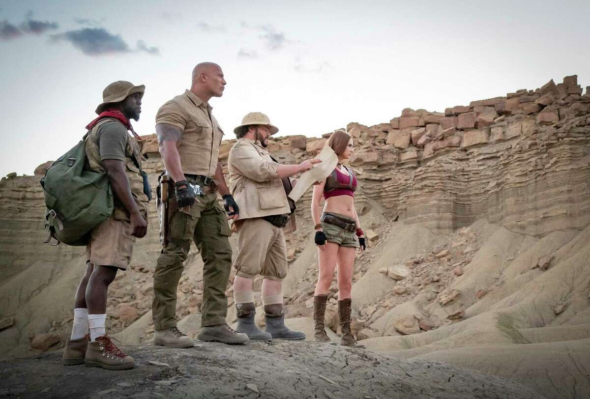 This image released by Sony shows Kevin Hart, from left, Dwayne Johnson, Jack Black and Karen Gillan in a scene from