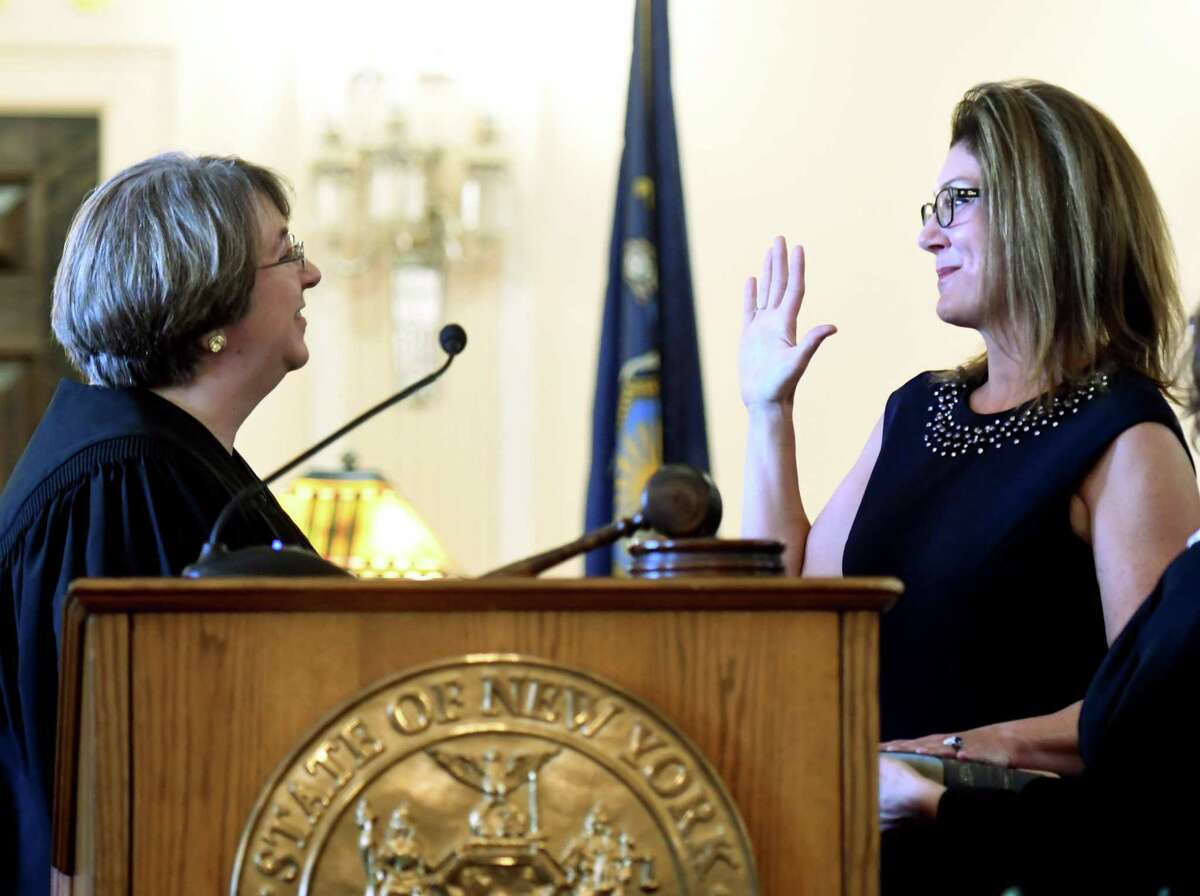 Andra Ackerman, right, is sworn in as an Albany County Court Judge by the Hon. Elizabeth A. Garry, left, during a ceremony on Friday, Dec. 20, 2019, at the Albany County Courthouse in Albany, N.Y. Ackerman, who served as a Cohoes City Court judge, made history by being the first woman elected to the position. (Will Waldron/Times Union)