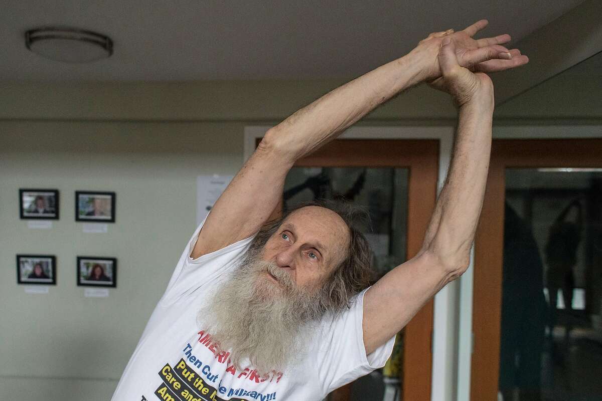 Jim Dorenkott participates in a yoga class at the Healing Well on Dec. 3, 2019 in San Francisco, Calif. The Healing Well is a nonprofit in the Tenderloin that has started gaining a following of homeless and low income residents to its yoga classes.