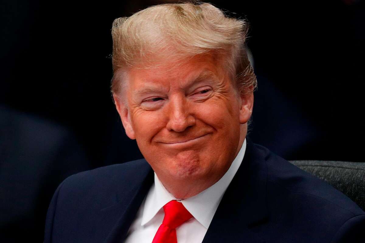 US President Donald Trump smiles during the plenary session of the NATO summit at the Grove hotel in Watford, northeast of London on December 4, 2019. (Photo by Adrian DENNIS / AFP) (Photo by ADRIAN DENNIS/AFP via Getty Images)
