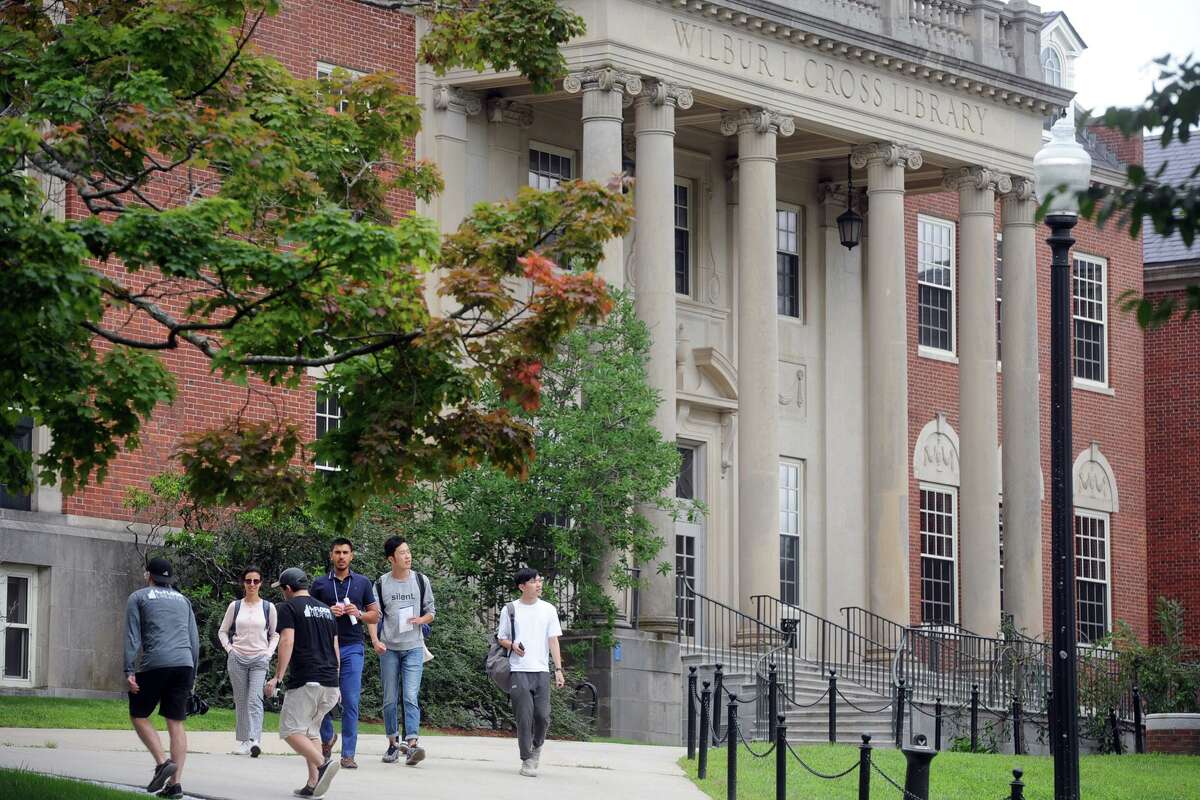 Students tour the University of Connecticut campus in preparation for the new school year, in Storrs, Conn. Aug. 20, 2018.