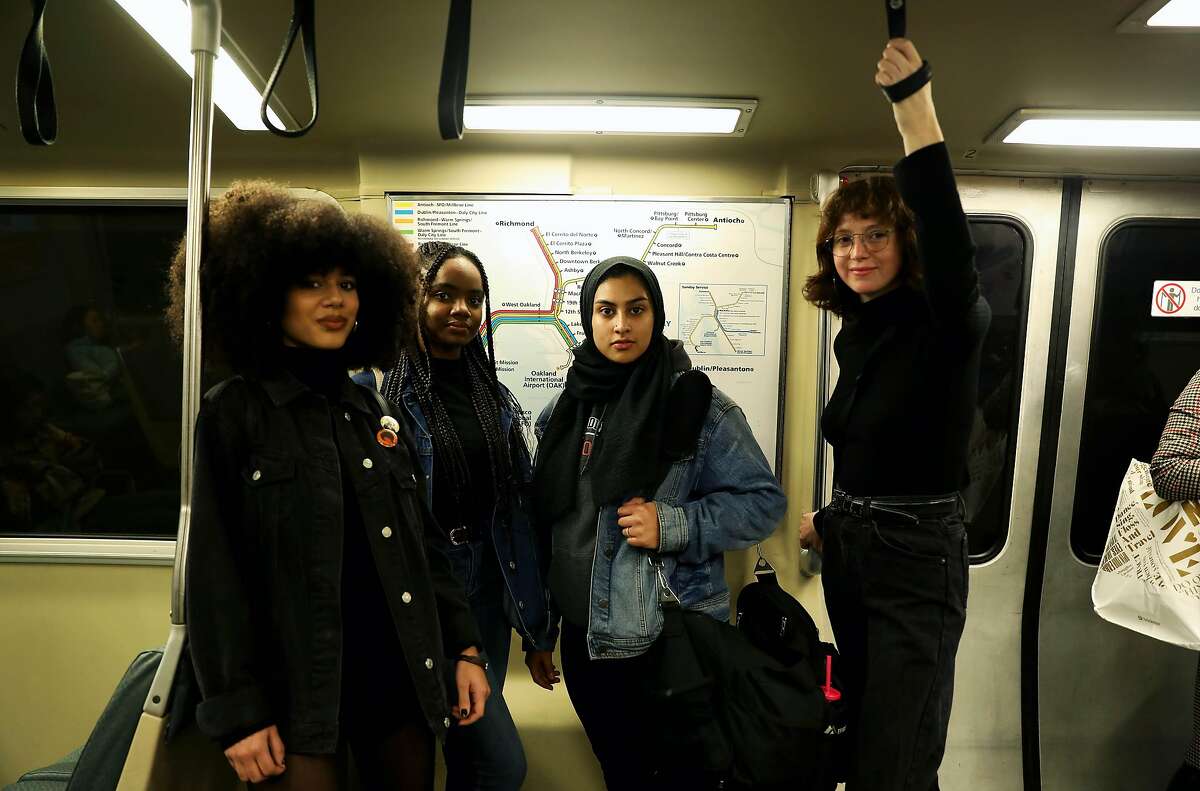 (Left to right) Mariah Tran, 20, a gender justice advocate, Uchenna Esomonu, 18, a gender justice advocate, Haleema Bharoocha, 21, advocacy manager, Alliance for Girls, and Itzel Sanchez, 21, organizing fellow, Alliance for Girls, pose for a portrait on a BART train in Oakland, Calif., on Thursday, December 19, 2019. BART met with the Alliance for Girls at the Betti Ono gallery near 12th street BART in Oakland on Dec. 16. It was a listening session, and opportunity to talk about the experiences of girls of color in the Bay Area. One hot topic: Girls of color don't feel safe on public transportation. Really, they don't feel safe in public, especially when they're walking to and from public transportation. More than a year after Nia Wilson was fatally stabbed on a BART platform, it seems like BART is making the prevention of harassment on public transportation a top priority.