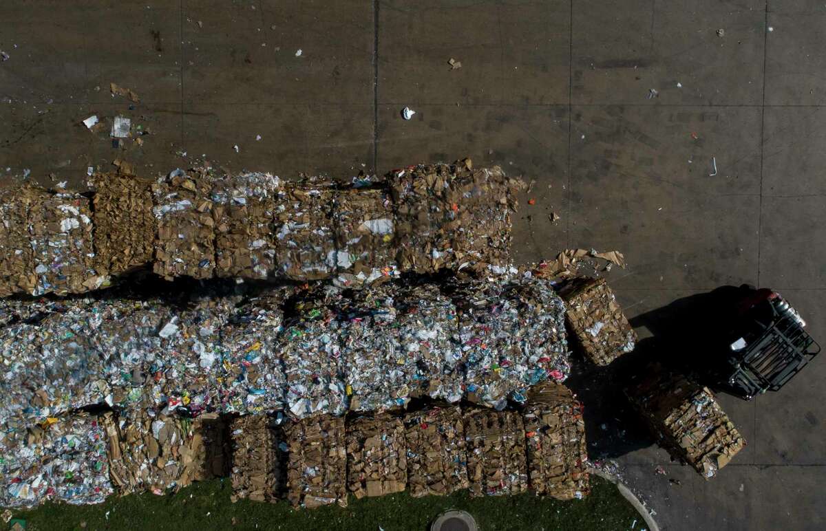 Bundles of sorted paper and cardboard are grouped together at the Balcones Resources recycling center Monday, Dec. 9, 2019, in Austin, Texas.