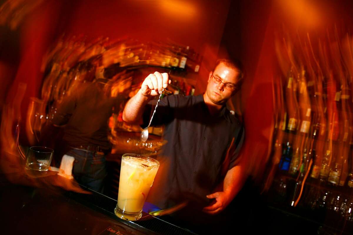 Aaron Prentice, owner of Cantina (580 Sutter) prepares a pitcher of pisco punch.