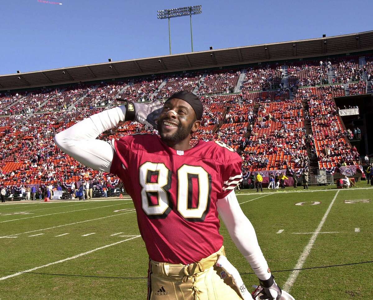 San Francisco 49ers wide receiver Jerry Rice gestures to the crowd before a game against the Chicago Bears, Sunday, Dec. 17, 2000, in San Francisco. The game could be Rice's last home game as a 49ers player, where he has played for 16 seasons. General manager Bill Walsh confirmed earlier in the week that the 49ers will release Rice after June 1 to gain about $2 million in salary cap room. (AP Photo/ Paul Sakuma)