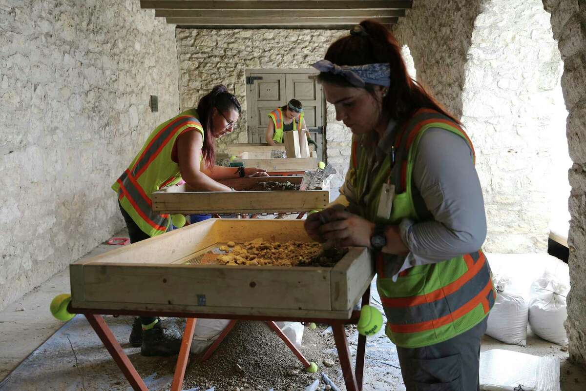 Raba Kistner archeologists Anna Schautteet (from front to back), Alesia Hoyle and Tyler Brown search through screens for artifacts at the Alamo's Long Barrack on Thursday, Aug. 29, 2019. Archaeological excavations at the Long Barrack unearthed what may be the oldest artifact ever found at the Shrine of Texas Liberty - a ceramic shard believed to date no later than 1725 - a year after the site became the third and final location of the Mission San Antonio de Valero. The blue, black and white tin-glazed shard, part of a ceramic known as Puebla Polychrome, was produced in Mexico from about 1650 to 1725. (Kin Man Hui/San Antonio Express-News)