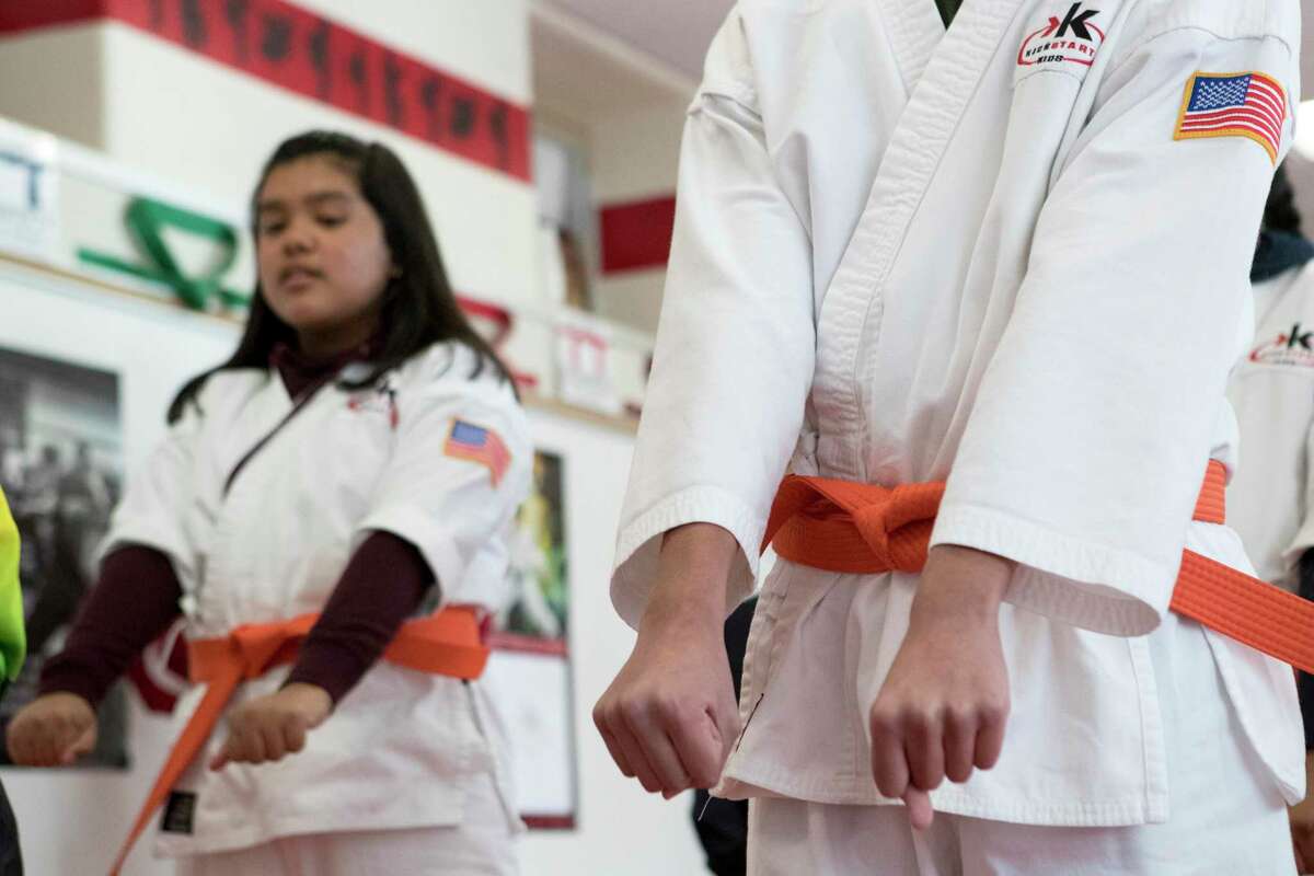 Roy White's students work out during a karate class at Burbank Middle School on Wednesday, Dec. 18, 2019, in Houston. HISD has had karate in schools for more than 25 years, becoming one of the largest operators of the Kickstart Kids program.