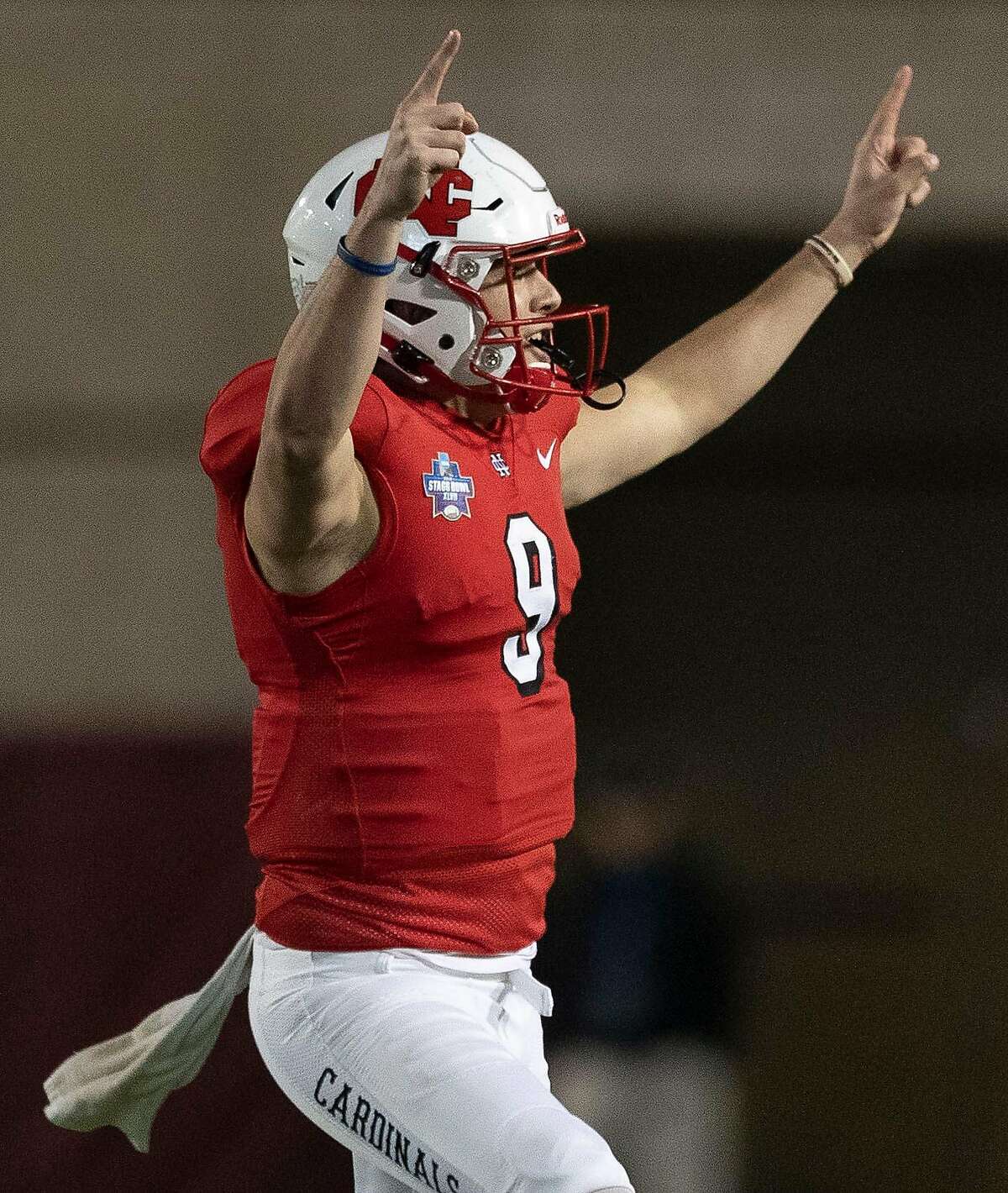North Central College quarterback Broc Rutter (9) reacts after throwing a 31-yard touchdown pass to wide receiver Blake Williams during the first quarter of the NCAA Division III college football championship at Woodforest Bank Stadium, Friday, Dec. 20, 2019, in Shenandoah.