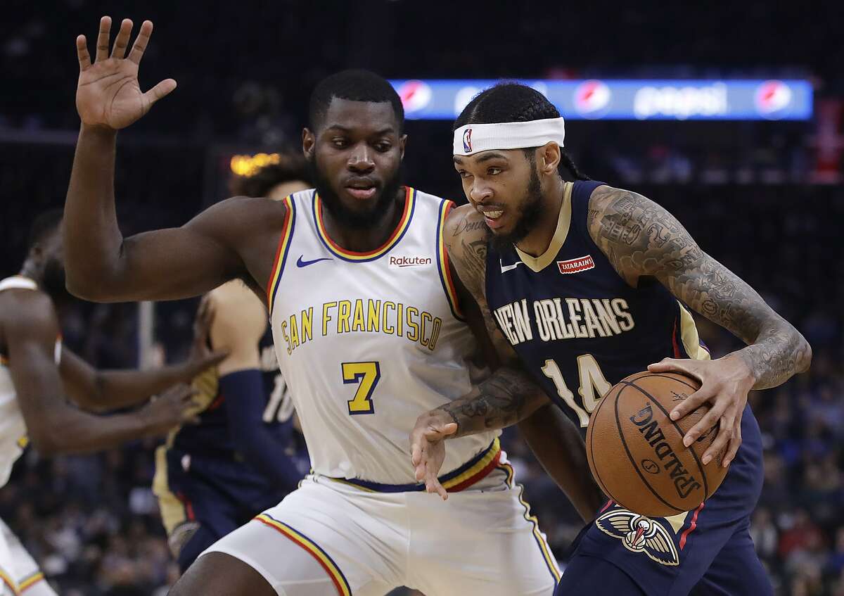New Orleans Pelicans' Brandon Ingram, right, drives the ball against Golden State Warriors' Eric Paschall (7) during the first half of an NBA basketball game Friday, Dec. 20, 2019, in San Francisco. (AP Photo/Ben Margot)
