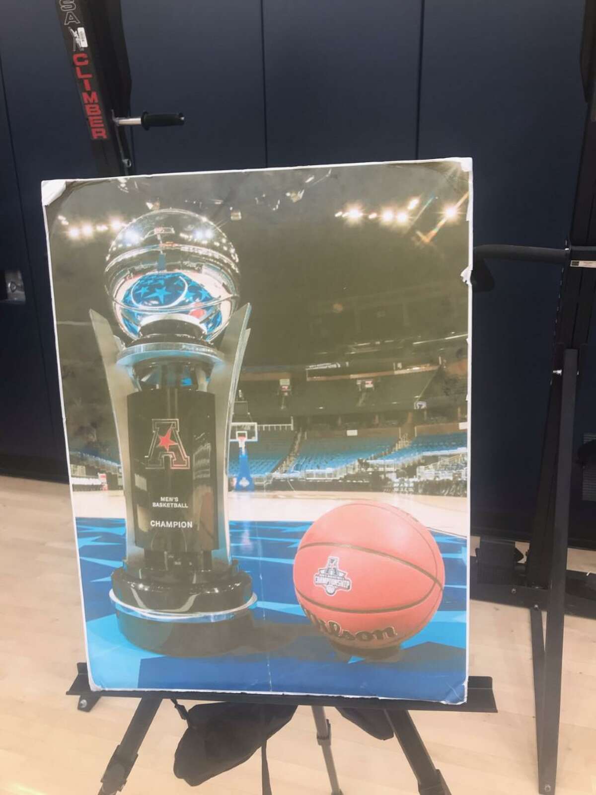 A photo of the AAC trophy travels everywhere with the UConn men’s team.