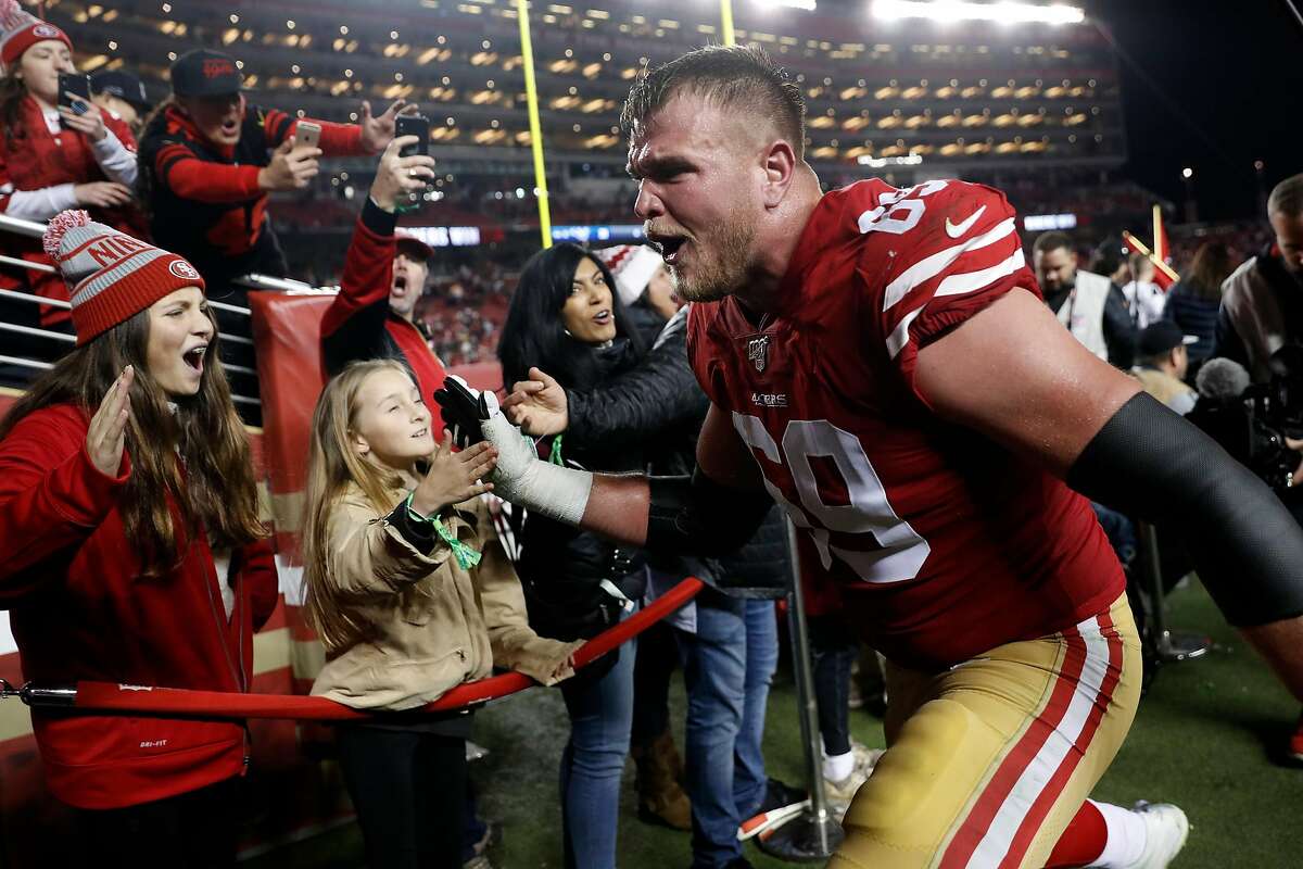San Francisco 49ers' Mike McGlinchey celebrates with fans after Niners' 34-31 win over Los Angeles Rams in NFL game at Levi's Stadium in Santa Clara, Calif., on Saturday, December 21, 2019.