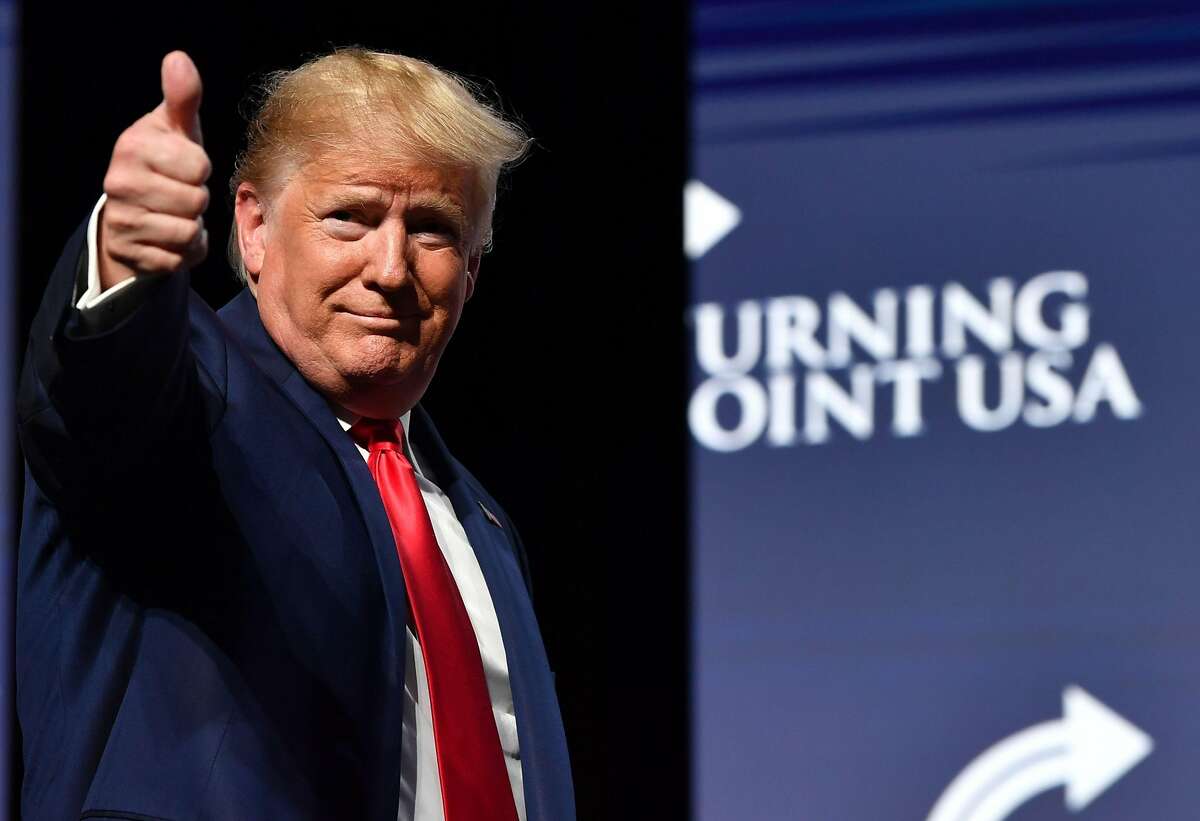 TOPSHOT - US President Donald Trump gestures during the Turning Point USA Student Action Summit at the Palm Beach County Convention Center in West Palm Beach, Florida on December 21, 2019. (Photo by Nicholas Kamm / AFP) (Photo by NICHOLAS KAMM/AFP via Getty Images)
