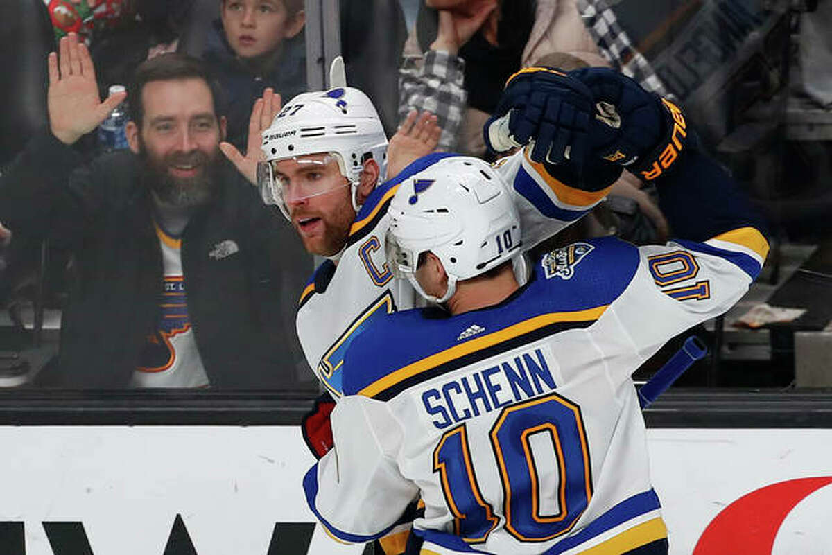 The Blues’ Alex Pietrangelo celebrates with Brayden Schenn (10) after scoring a goal against the Sharks during the third period Saturday night in San Jose, Calif.