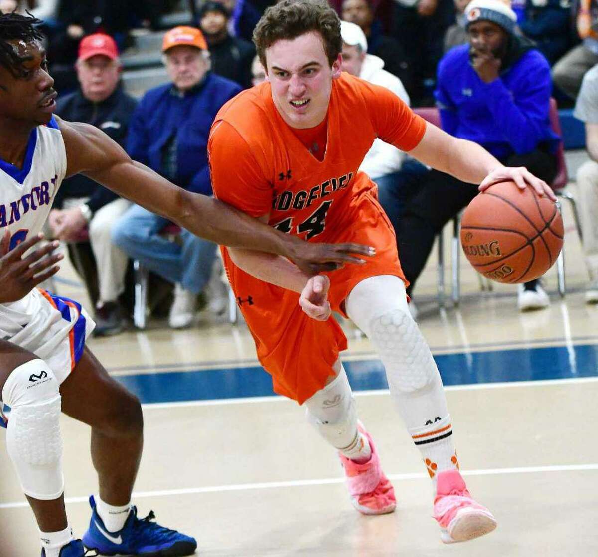 Chris Knachel (shown last season) had 13 points and 11 rebounds in Ridgefield’s road win over Fairfield Ludlowe on Friday night.