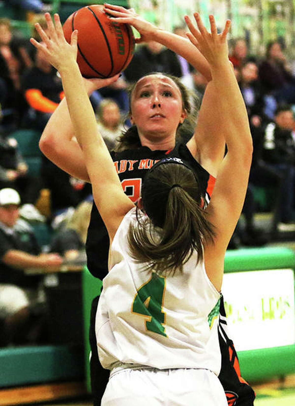 Gillespie’s Emily Schmidt, shown shooting over Southwestern’s Josie Bouillon (4) during a Dec. 5 game in Piasa, scored 13 points Saturday in a Miners’ win over Calhoun in Gillespie.