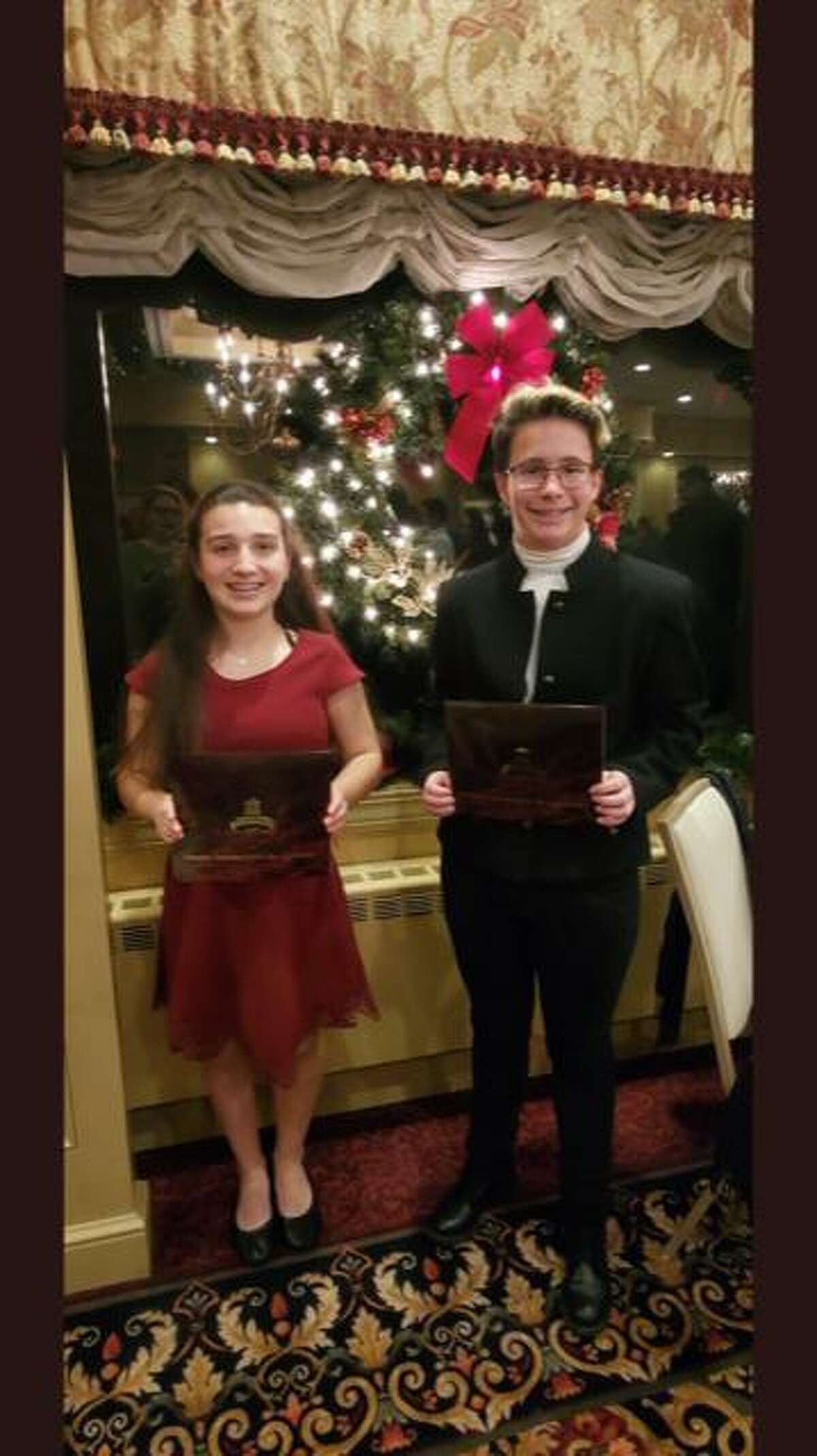 Shelton Intermediate School eighth graders Marissa Manzo and Robin Uhrynowski, who each earned Connecticut Association of Public School Superintendents (CAPSS) Superintendent/Student Recognition Awards earlier this month.