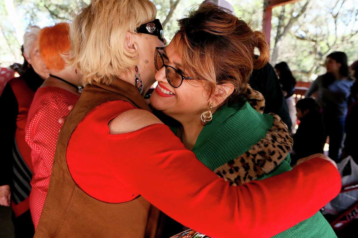 Pamela Allen, right, receives a hug from Sandra Dance during a Christmas party with Santa Claus hosted by Allen at her home in Boerne on Saturday, Dec. 14, 2019. Allen, a co-founder of Eagles Flight Ministries, has advocated for a wide range of people that have included refugees, children with special needs and the homeless for the past 28 years.