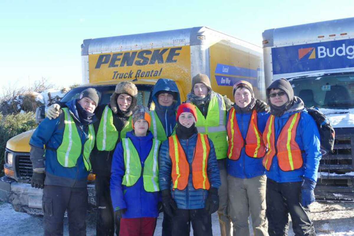 Boy Scout Troop 116 members at last year’s Christmas tree pick up on South Street.