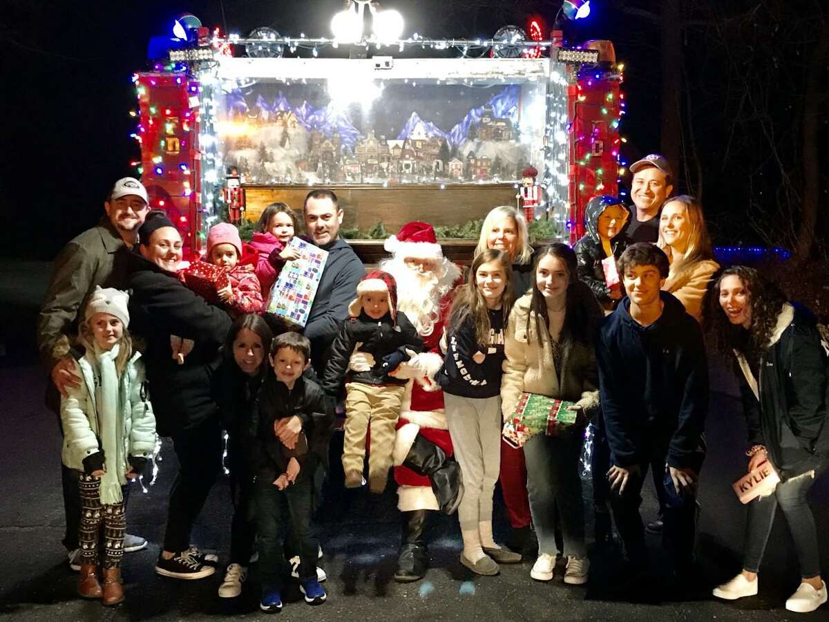 Santa made one of his many stops recently, visiting families on Linley Road. He was brought in on the Long Hill Volunteer Fire Company's lighted firetruck.
