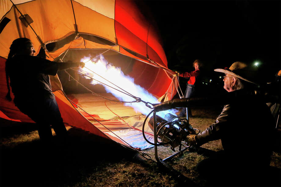 Bruce Lavorgna of Austin inflates his hot air balloon, Aerodactyl, at the Skylight Balloon Fest on the River City Community Church grounds in Selma on Saturday, Oct. 26, 2019. The three day event featured nightly balloon glows, morning balloon launches, tethered balloon rides, parachute jumps by the RE/MAX Skydiving Team, concerts and a family fun zone. Photo: Marvin Pfeiffer / Express-News 2019