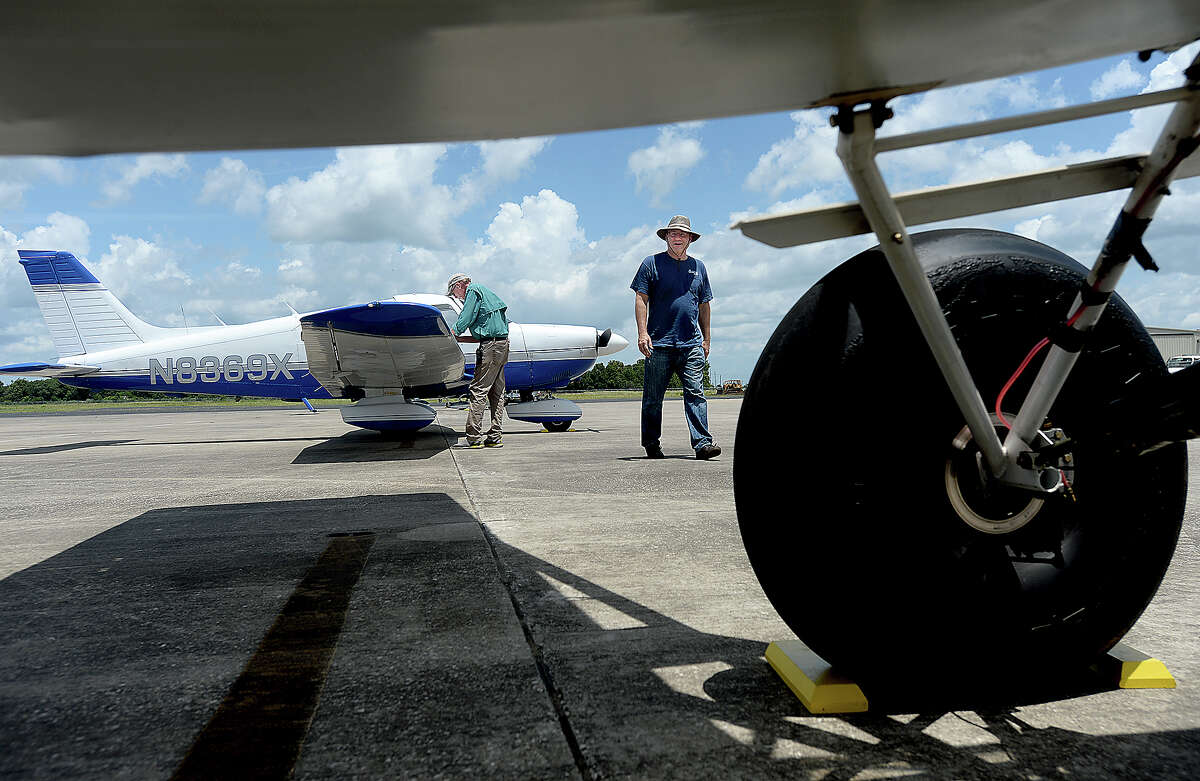Pilots and spectators make their way round the tarmac during the Fly Beaumont Food Truck Day at the Beaumont Municipal Airport Saturday. Several small craft and helicopters flew in for the event, allowing spectators to get a close-up view of the planes and learn about them from their owners. Photo taken Saturday, July 20, 2019 Kim Brent/The Enterprise