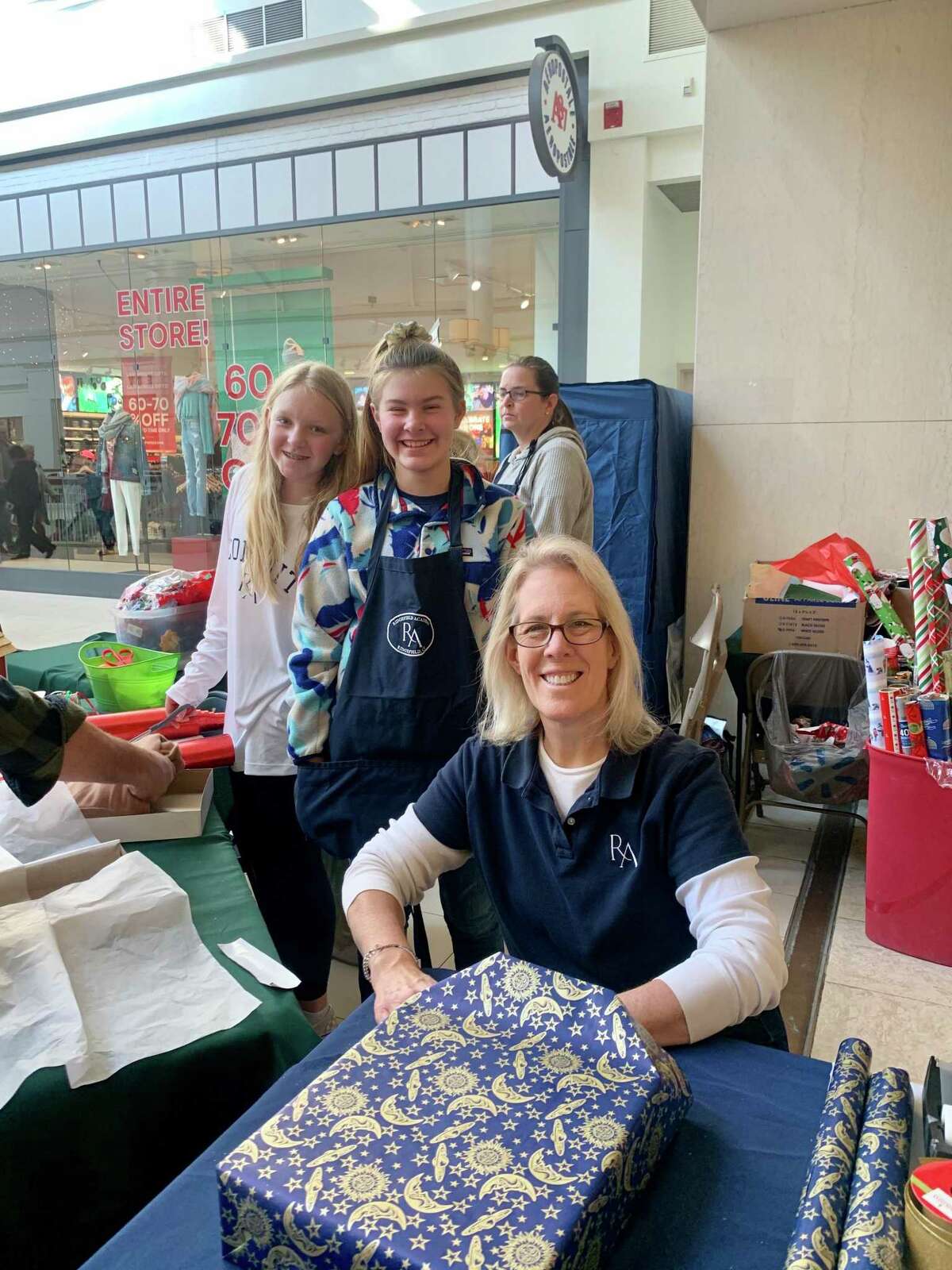 Ridgefield Academy students volunteered to wrap gifts for Habit for Humanity at Danbury Fair Mall in December.