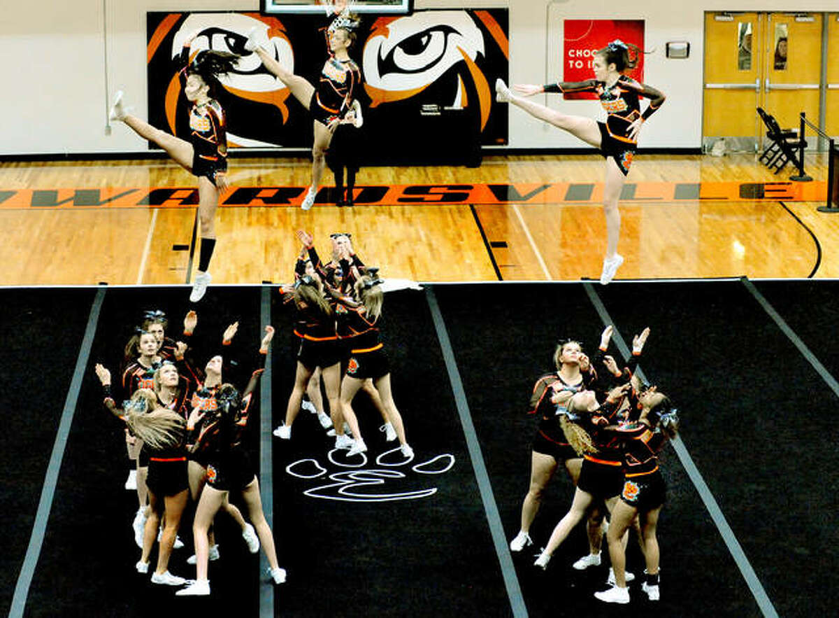 Edwardsville High School Varsity and JV cheerleaders compete during the Edwardsville ICCA Invitational.
