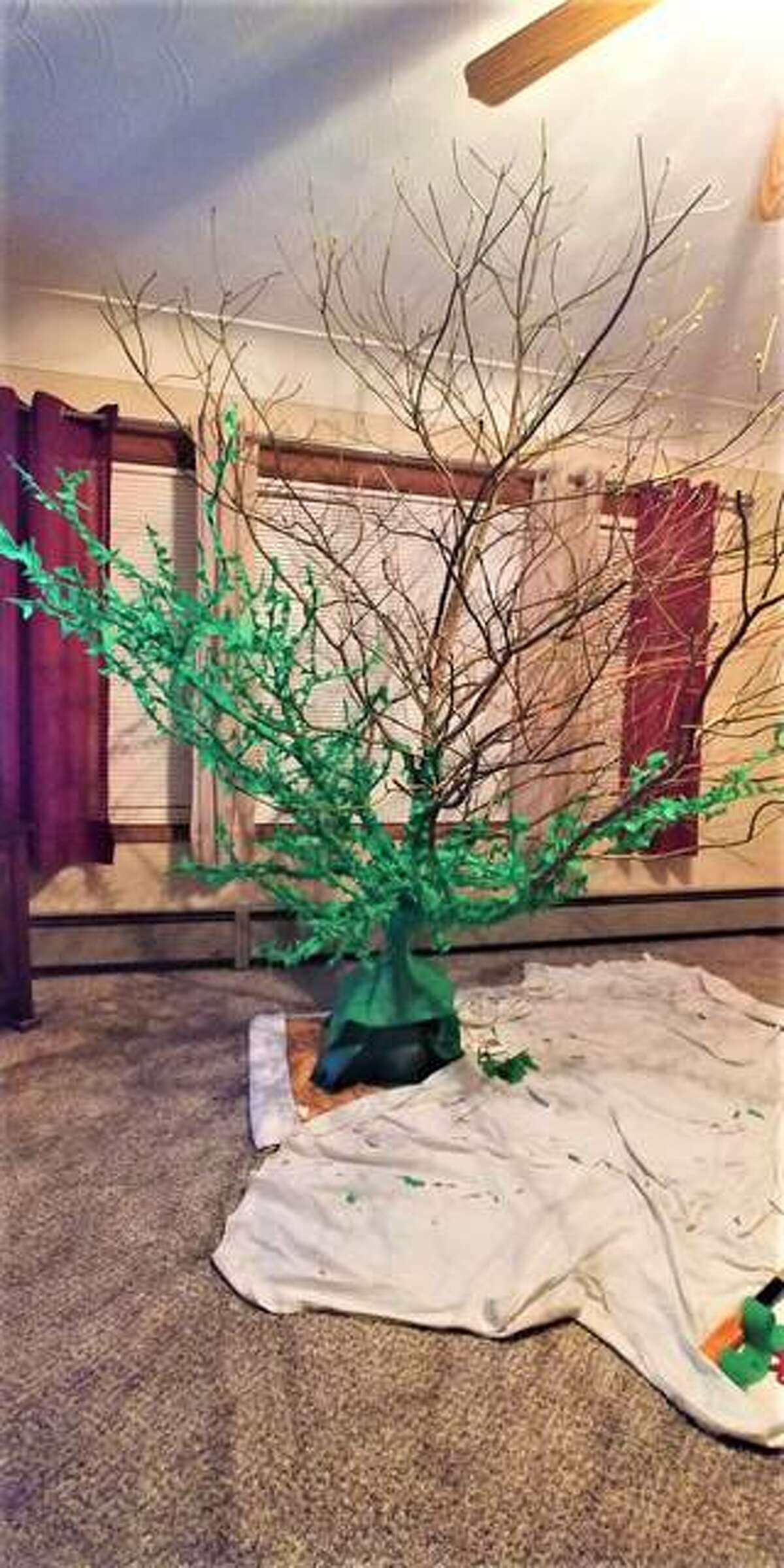 The two trees that formed Diana Sugg’s sassafras Christmas tree required 31 hours of crepe paper wrapping. She and her mother, Carol Rives, then spent 12 hours decorating the completed tree.