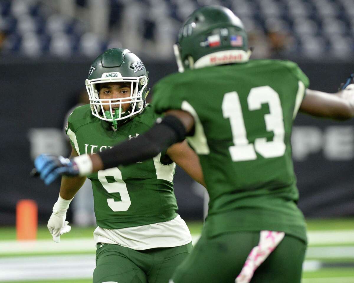Dylan Campbell (9) and Robert Smith (13) of Strake Jesuit celebrate a touchdown during the first quarter of a Class 6A Division II Region III semifinal football playoff game between the Strake Jesuit Crusaders and the Cy Creek Cougars on Friday, November 29, 2019 at NRG Stadium, Houston, TX.