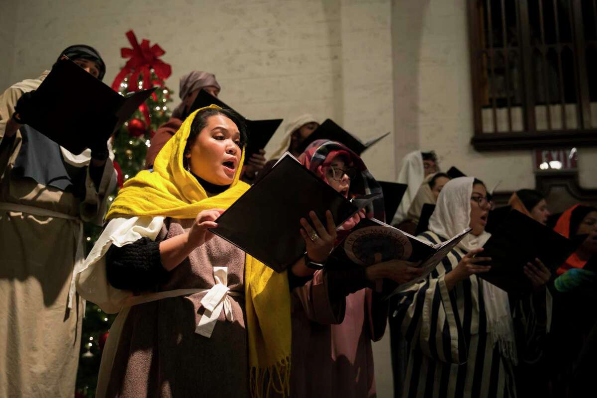 Members of the choir sing during the Christmas pageant at St. Mark's United Methodist Church on Saturday, Dec. 21, 2019.