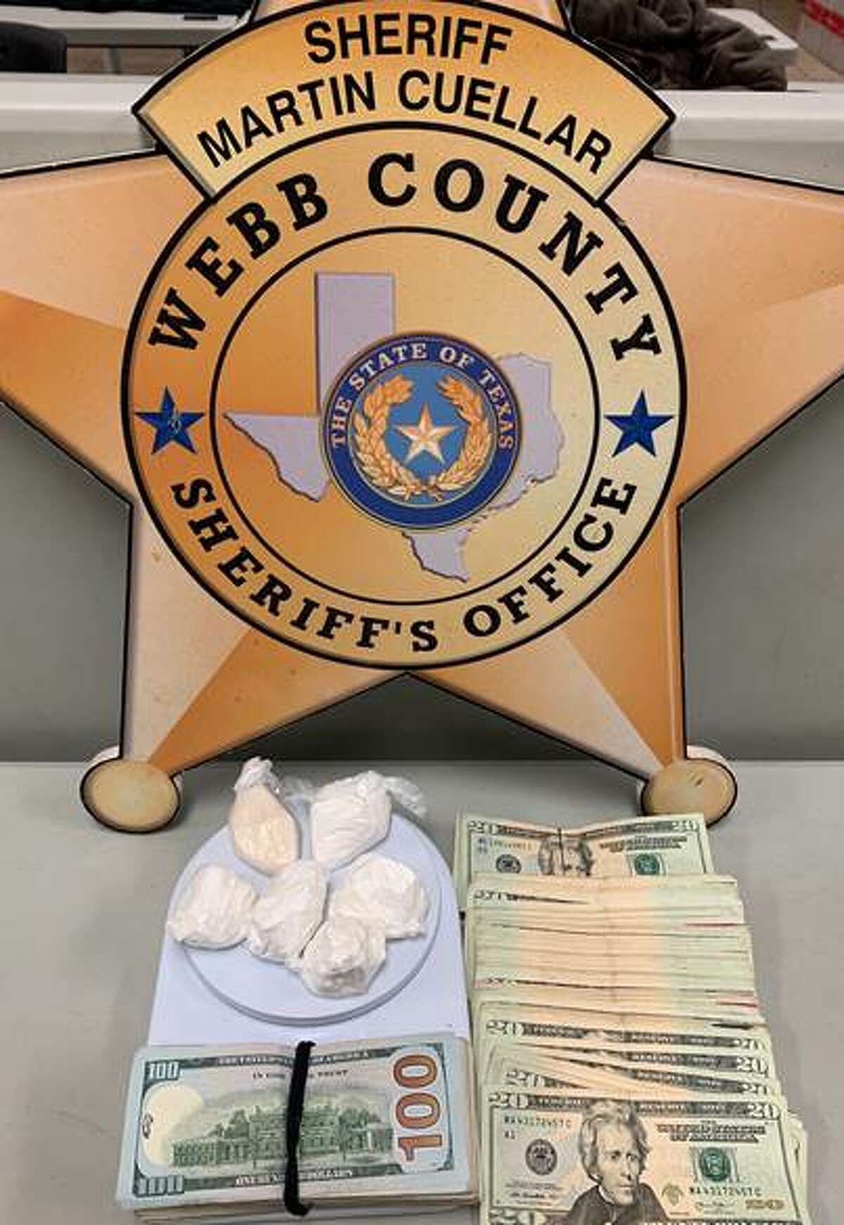 Shown are the 5.4 ounces of cocaine and $2,474 seized Friday from a residence in the 1300 block of Rosario Street.