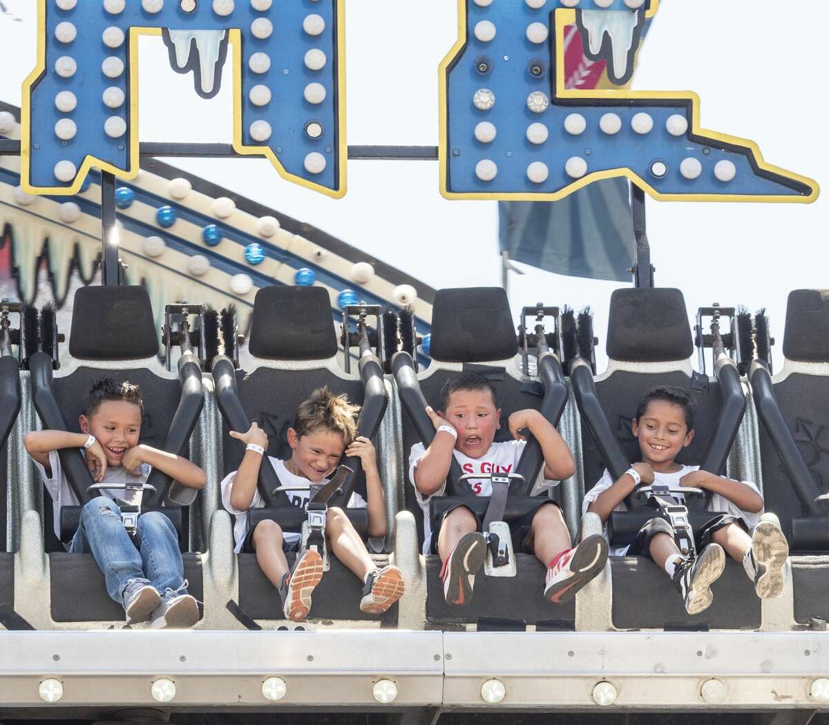 Youth take a ride on Aug. 24 at the Midland County Fair at the Horseshoe.