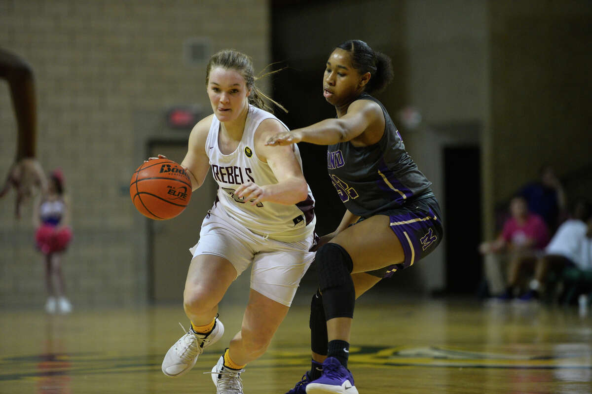 Lee High School’s Paige Low dribbles against Midland High's Desiree Goodley on Jan. 15 at Chaparral Center.