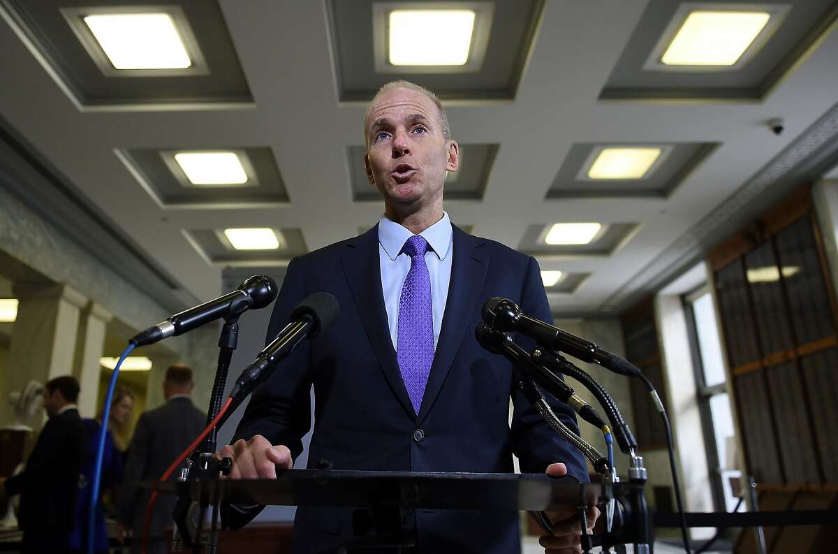 In this file photo taken on Oct. 30, 2019, then-Boeing CEO Dennis Muilenburg makes a statement to the media before testifying at a hearing in front of a congressional lawmakers on Capitol Hill in Washington, D.C.