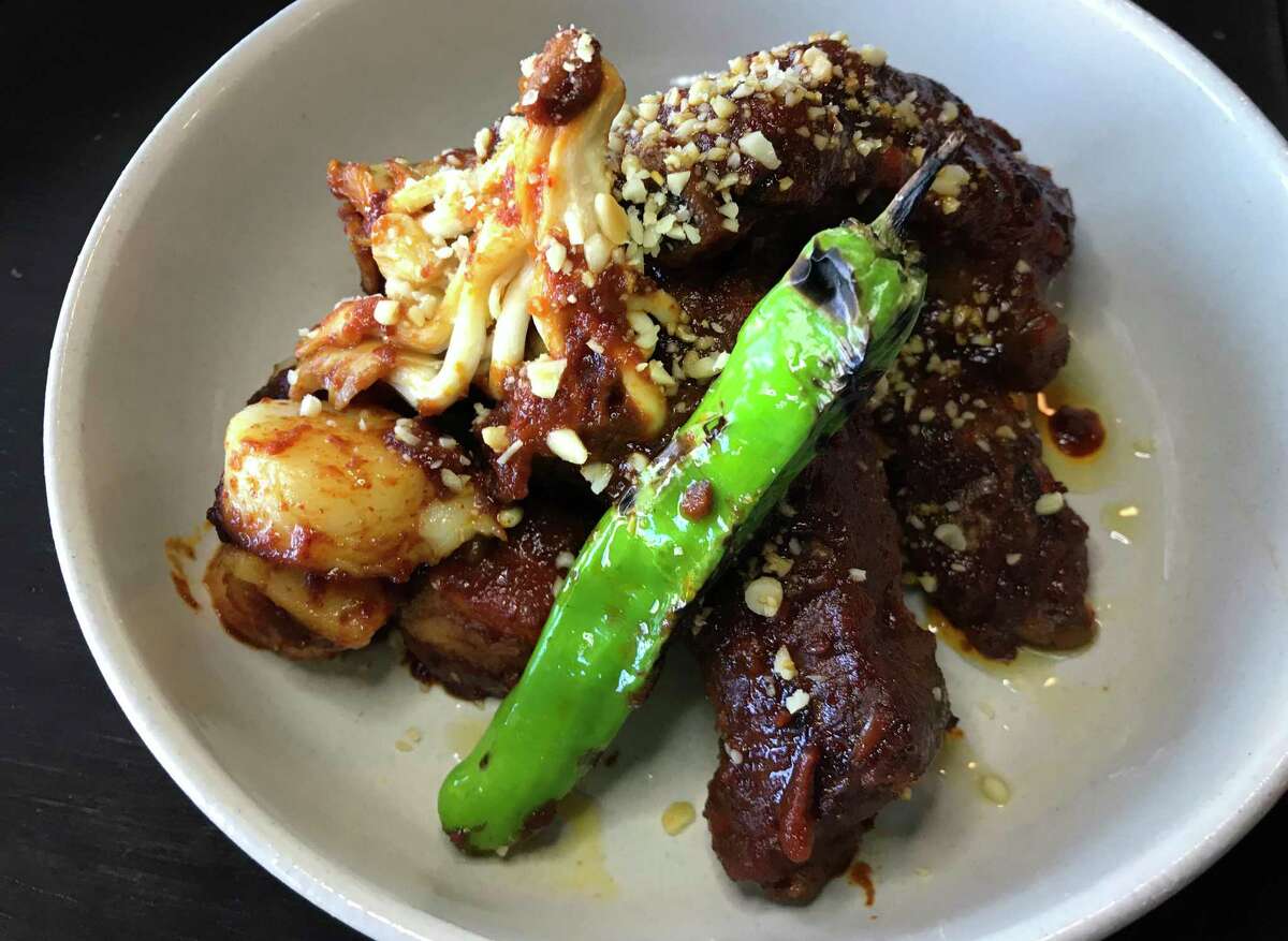 Galbi jjim from The Magpie is a dish of spicy Korean pork ribs, rice cake, mushrooms and tempura vegetables.