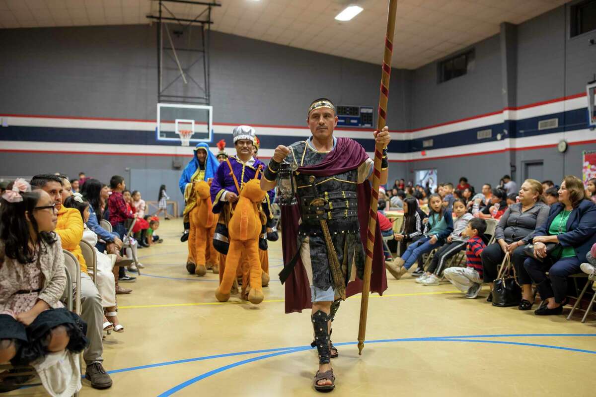 A roman solider guides the "3 kings" during a celebration of Las Posadas, Saturday, Dec. 7, 2019, in Conroe. The event is a Catholic tradition observed by Hispanic parishioners that commemorates the journey Joseph and Mary made from Nazareth to Bethlehem in search of refuge where Mary could give birth to Jesus.
