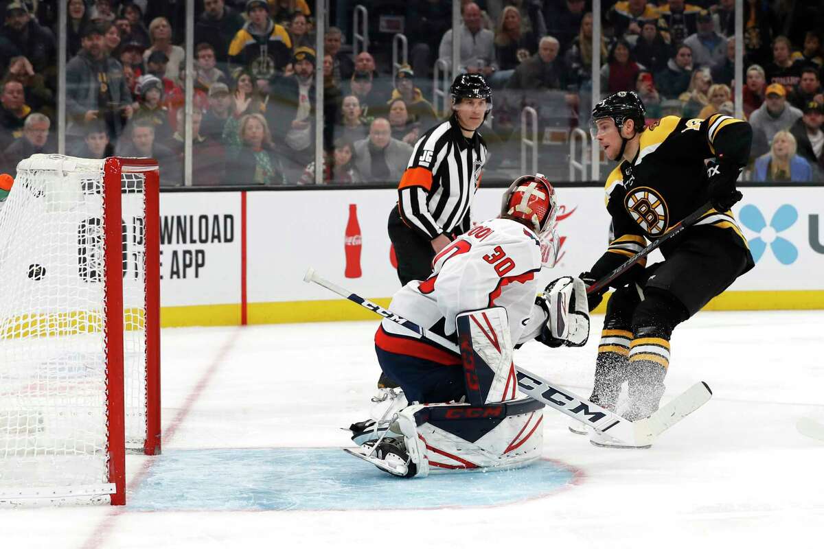 Boston Bruins' Charlie Coyle scores a shorthanded goal on Washington Capitals goaltender Ilya Samsonov during the second period of an NHL hockey game Monday, Dec. 23, 2019, in Boston. (AP Photo/Winslow Townson)