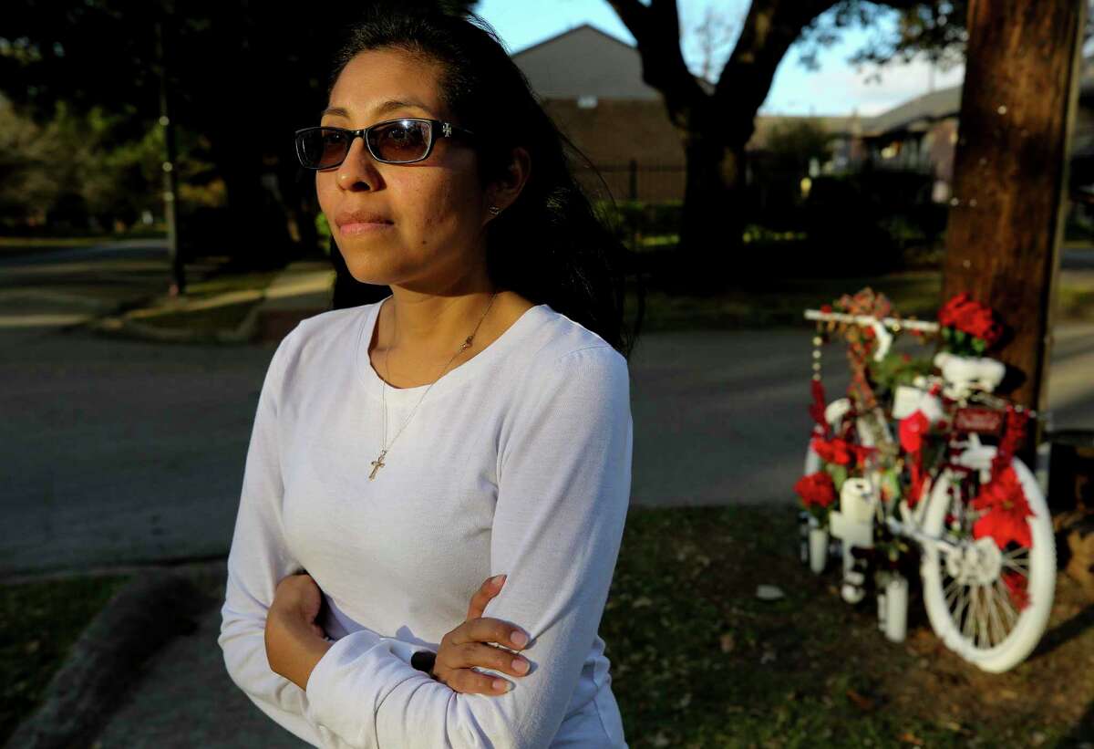 Teresa Pinales treats the white bike at the corner of Heights Blvd and 8th Street as a reminder of her son’s spirit. Her son, David Loya, was hit and killed by an HISD bus driver while riding his bike in March.