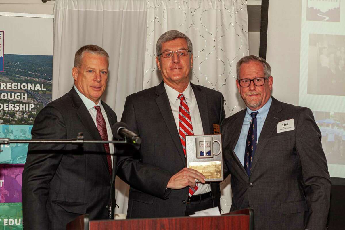 Pullman & Comley, one of the state’s largest legal firms, earned the Greater Valley Chamber of Commerce’s Milestone Award for its 100th anniversary. Pictured are Chamber Board Chairman Rob Lesko, left, Chamber Director Kevin Foley, Sr., from Cushman & Wakefield, and attorney James “Tim” Shearin, chairman of Pullman & Comley.