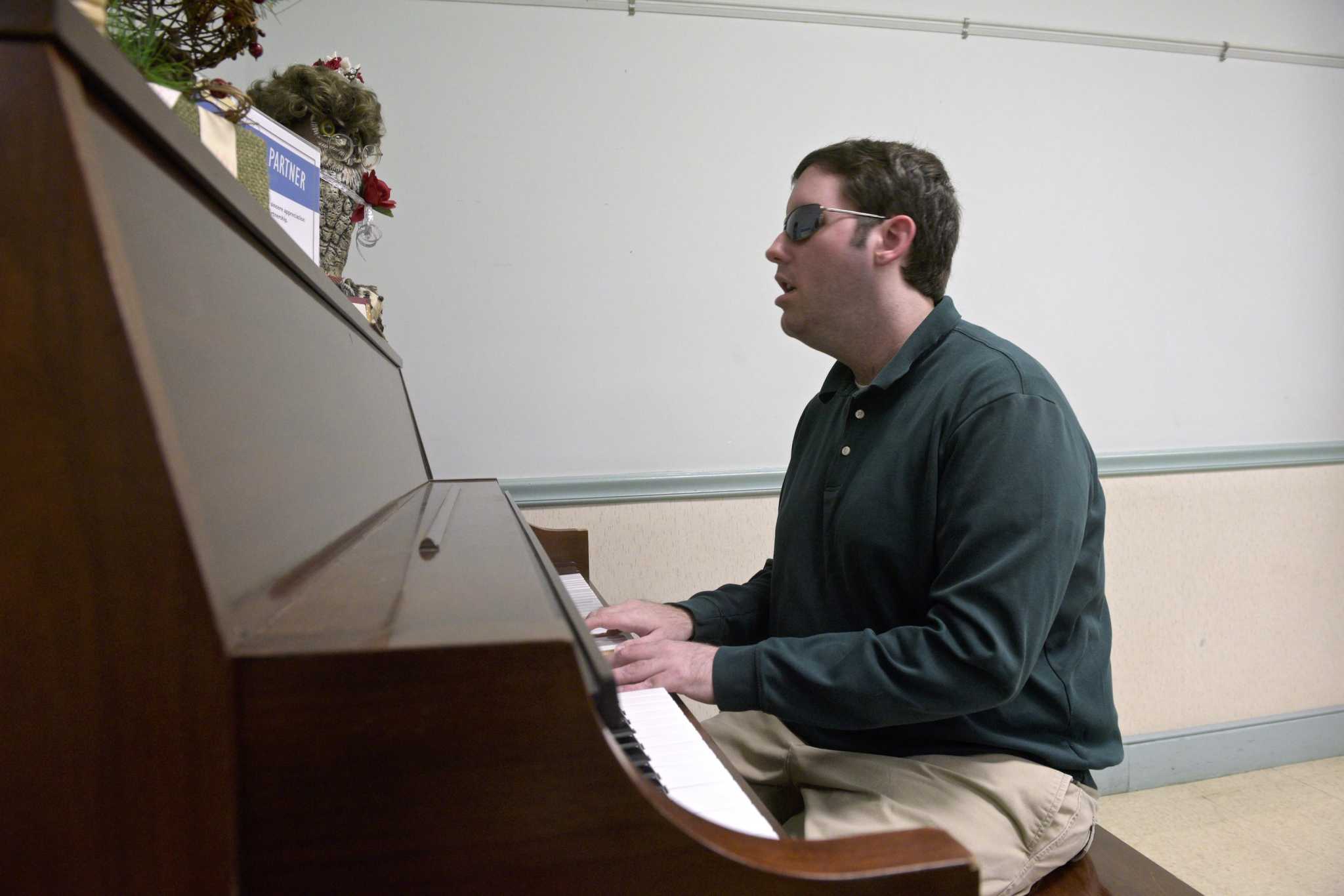 Blind, half-deaf Danbury pianist got start with stranger's gift