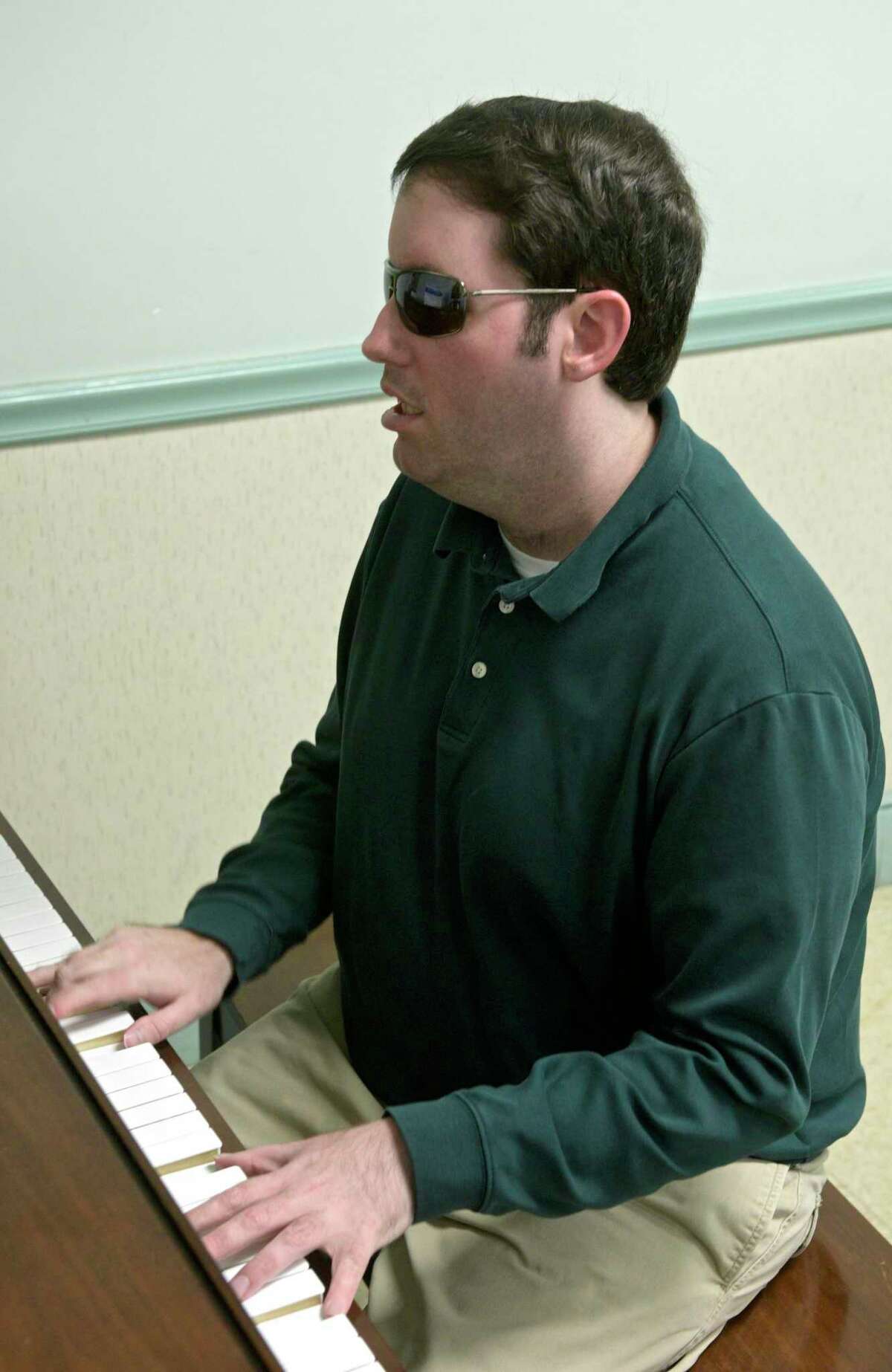 Blind, half-deaf Danbury pianist got start with stranger's gift