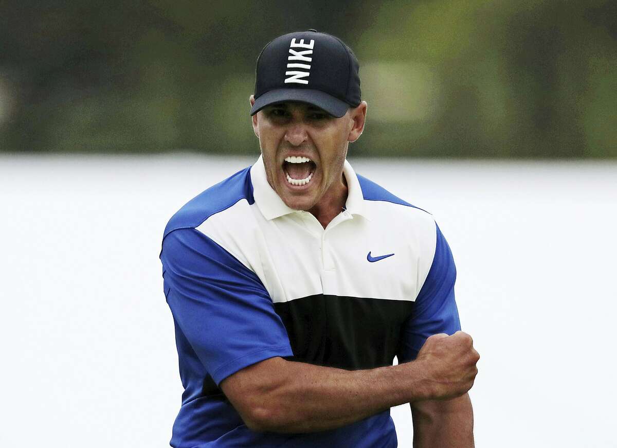 FILE - Brooks Koepka reacts after sinking a putt on the 18th green to win the PGA Championship golf tournament, Sunday, May 19, 2019, at Bethpage Black in Farmingdale, N.Y. Koepka says his play out of an awkward lie on the 18th that led to par was one of his most important shots. (AP Photo/Charles Krupa)