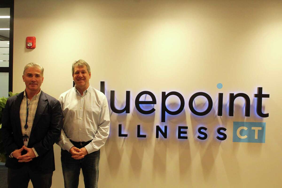 Nick Tamborrino, left, and David Lipton work alongside each other to run Bluepoint Wellness Dispensary based in Westport. Taken Dec. 23, 2019 in Westport, Conn.