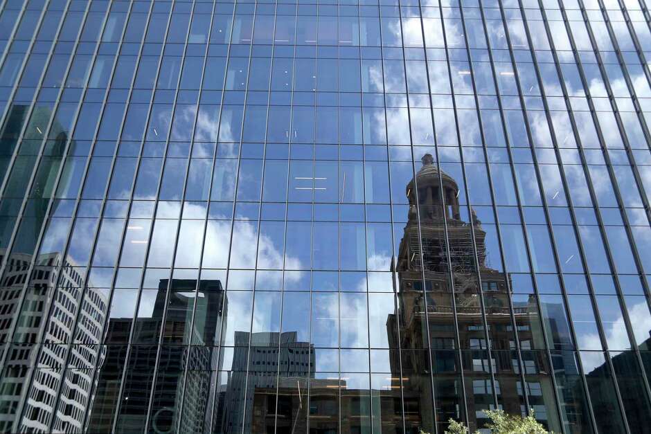 The Bank of America Tower, Wednesday, May 22, 2019, with the Esperson Building reflected in the windows. The Bank of America Tower, a 35-story office building and a development of Skanska in downtown, has been under construction for the last two years at 800 Capitol St.
