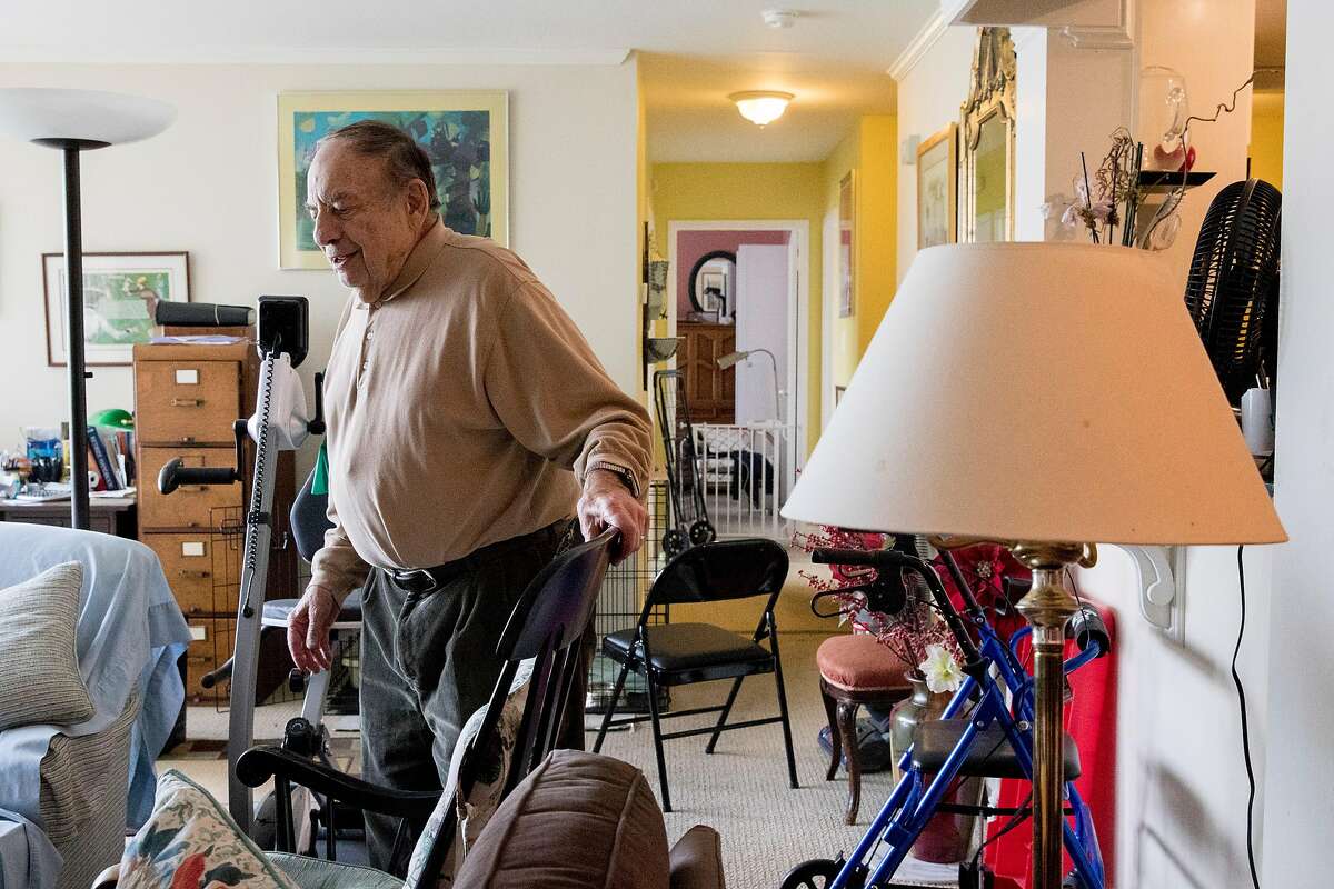 Charles Gusick walks through the living room of his home in Mill Valley, Calif. Wednesday, December 24, 2019.