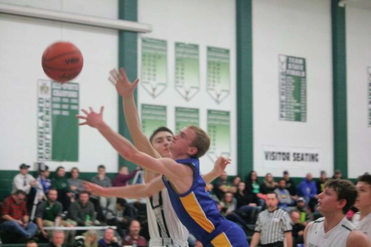 Evart's Cam Brasington goes to the basket against Pine River on Thursday. (Herald Review photo/John Raffel)