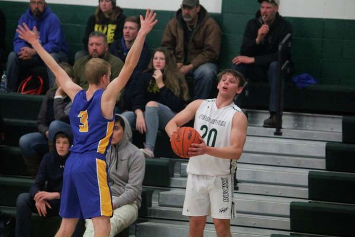 Pine River's Sasha Huffman (20) looks to make a play against the Evart defense. (Herald Review photo/John Raffel)