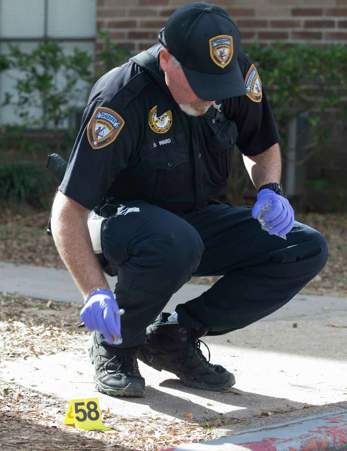 A Harris County Sheriff's Office Crime Scene Unit investigator investigate the scene where a 15-year-old boy shot 17-year-old girlfriend in the leg at an apartment complex on the 300 block of Parrametta Lane on Wednesday, Dec. 25, 2019, in Houston. It was unclear whether it was accidental or intentional, Sheriff Ed Gonzalez said. The victim was taken to the hospital and in stable condition.