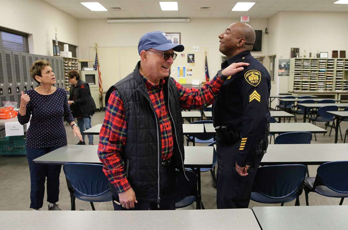 Jerry Gerson (left) offers his appreciation for San Antonio Police Sgt. Malcolm Guidry after Gerson and several volunteers drop off meals for police officers at the Southeast Substation off Houston Street. Members of the Jewish congregation of Temple Beth-El provided meals Wednesday to first responders who had to work on Christmas Day at 55 police and fire stations across Bexar County.
