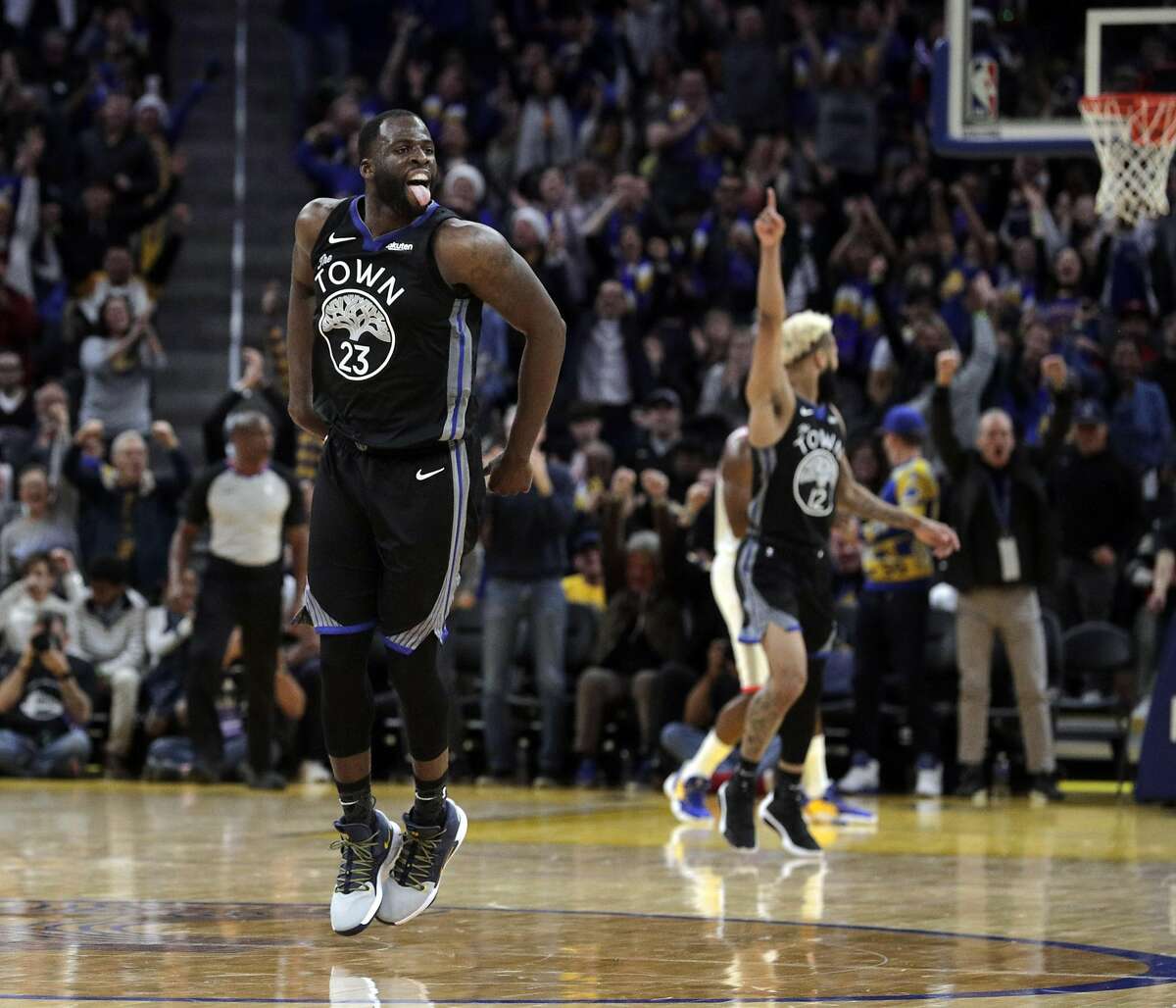 Draymond Green (23) reacts after he hit a three pointer late in the second half as the Golden State Warriors played the Houston Rockets at Chase Center in San Francisco, Calif., on Wednesday, December 25, 2019.